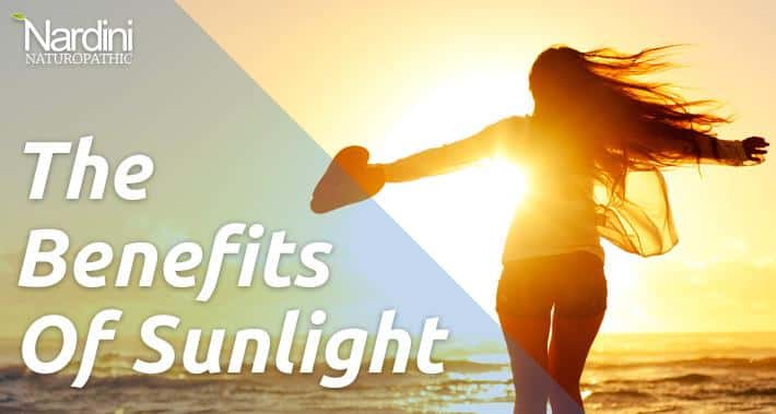 The Benefits of Sunlight | Women Spreading Her Arms on the Beach Looking at the Sun | Dr. Pat Nardini | Toronto Naturopath